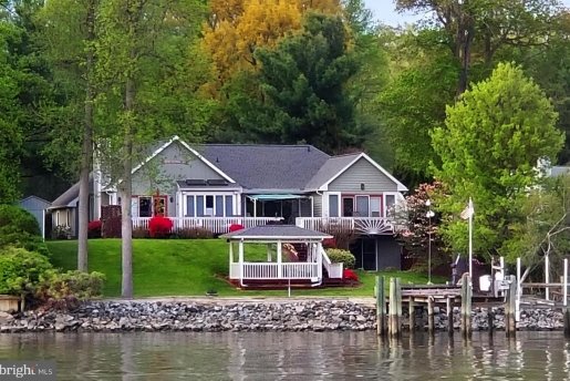 house on the water with gazebo